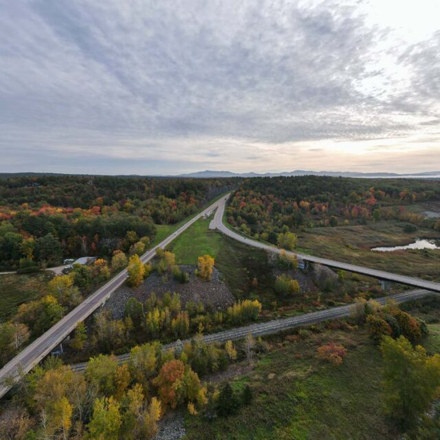 http://Aerial%20view%20of%20highway%20with%20Vermont%20foliage