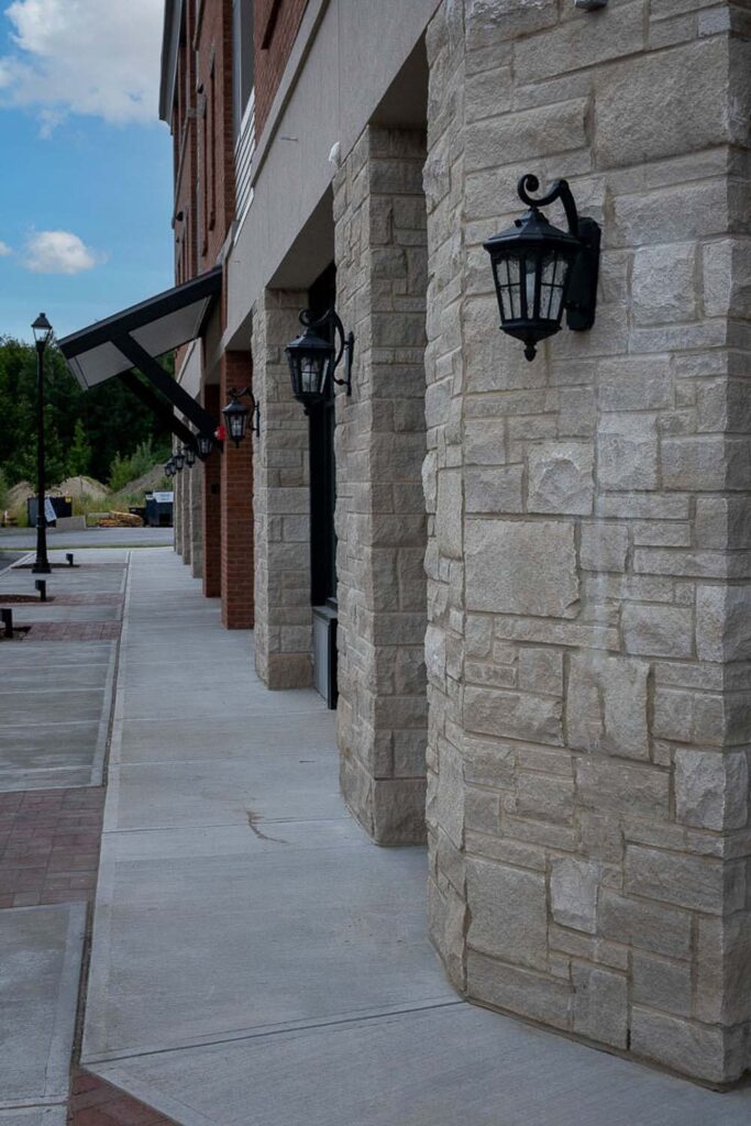 View of sidewalk with exterior lighting at 32 Cottonwood Crossing