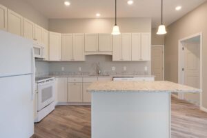 Cottonwood Crossing kitchen with bisque cabinets and island