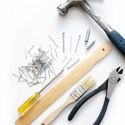 Tools Pile Nails Hammer Plyer Brush Screwdriver